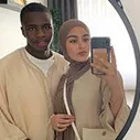 Meriam Sabri and her husband taking selfie in front of mirror