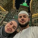 Asif with wife in front of makkah tower